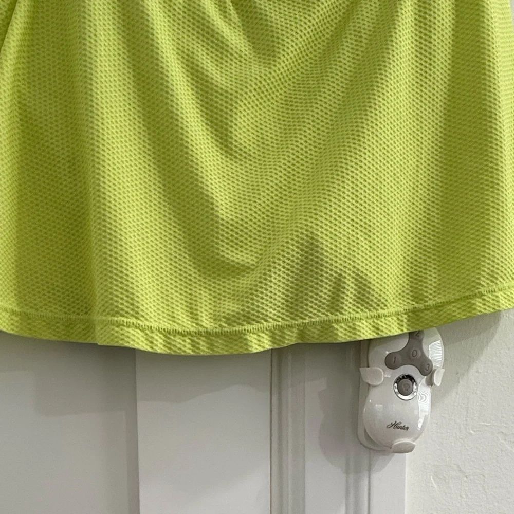 Fila neon yellow green mini skort w/ multicolor butterfly pattern